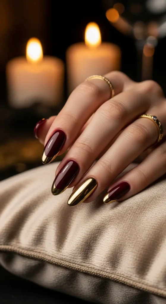 Burgundy gold chrome almond nails