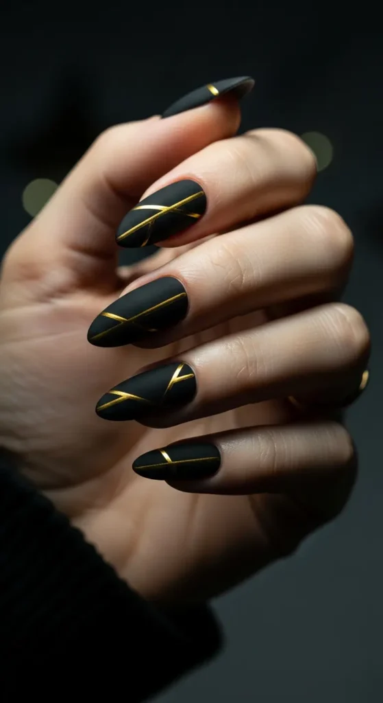 Matte black gold geometric nails