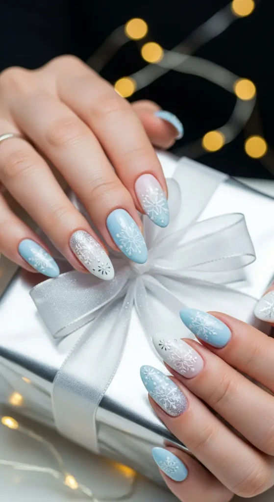 Winter nail ideas with blue ombre and snowflake Christmas nail art