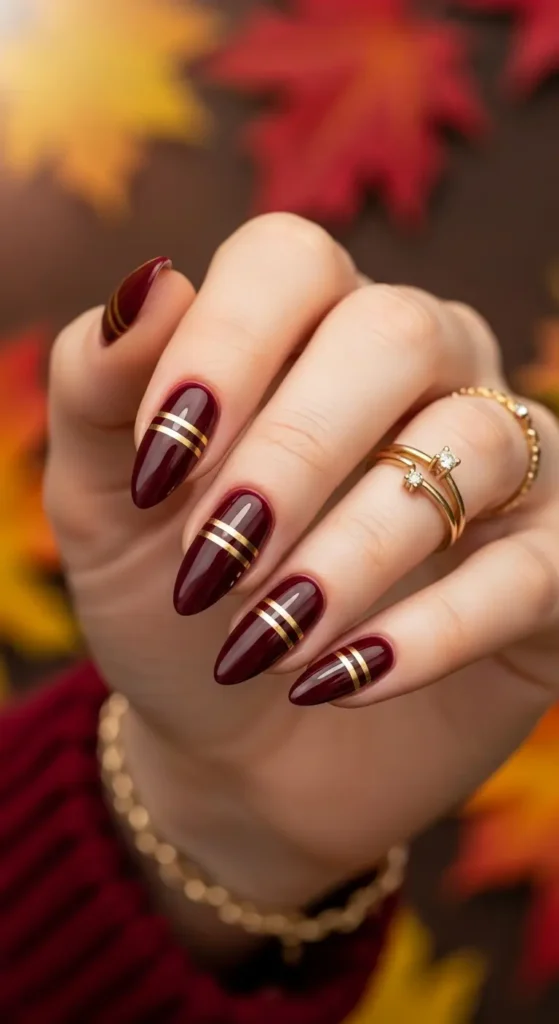 Burgundy gold fall nails